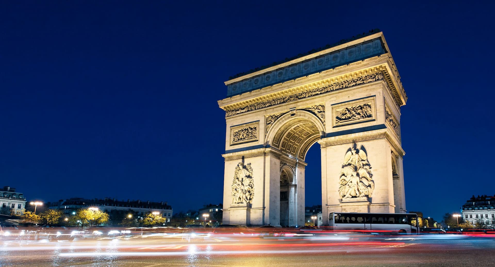 The Arc de Triomphe in Paris illuminated at night